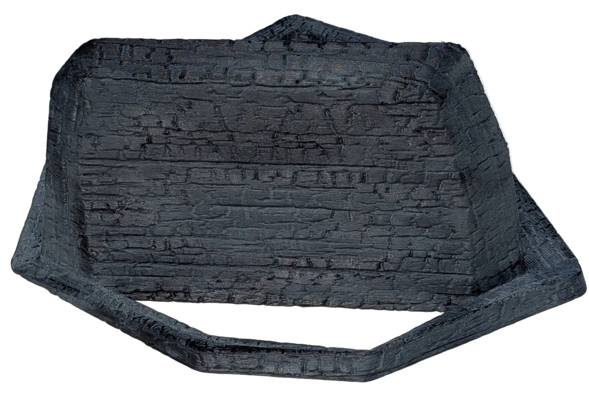 Pentagon-shaped charcoal wall shelf, angled view showing the shelf ledge