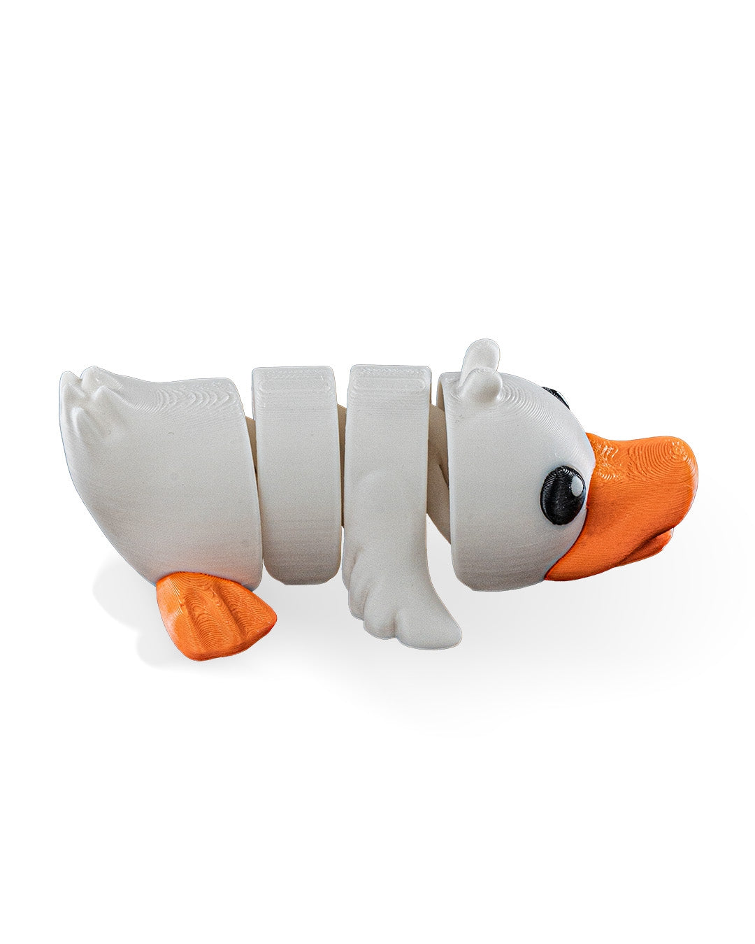A 3D-printed articulated toy duck with a white body, orange beak, and orange feet, shown on a clean white background.