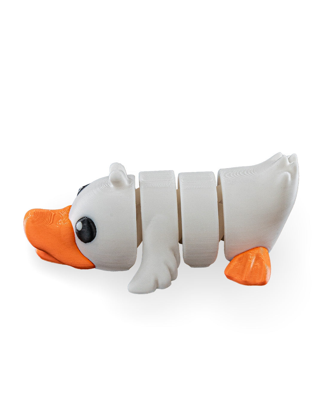 A white segmented duck toy with orange beak and feet, photographed on a clean white background.