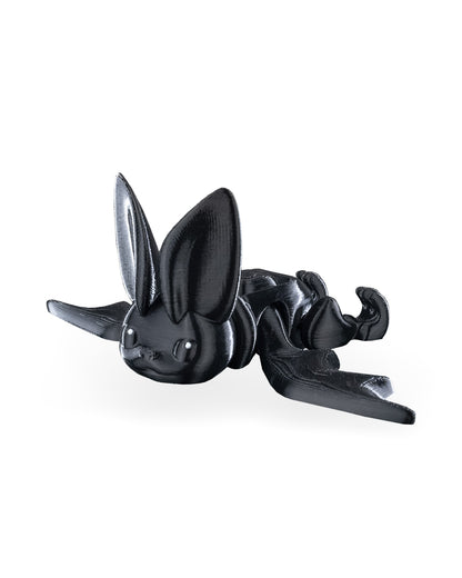 Side view of the black bat fidget toy with wings extended