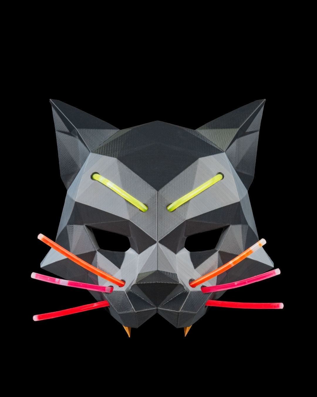Geometric cat mask with colorful accents on a black background
