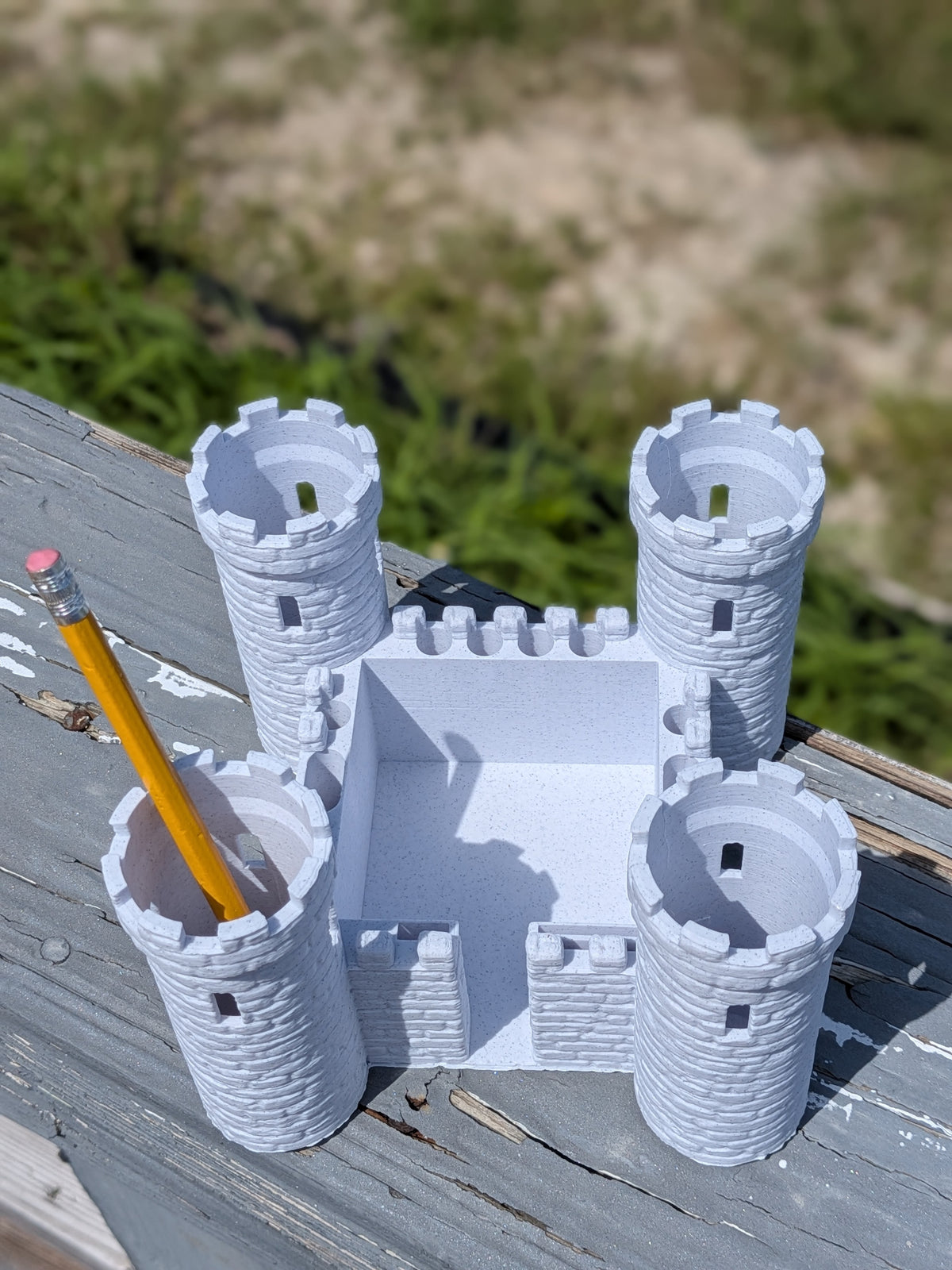 Castle desk organizer, angled view showing sticky note ledge