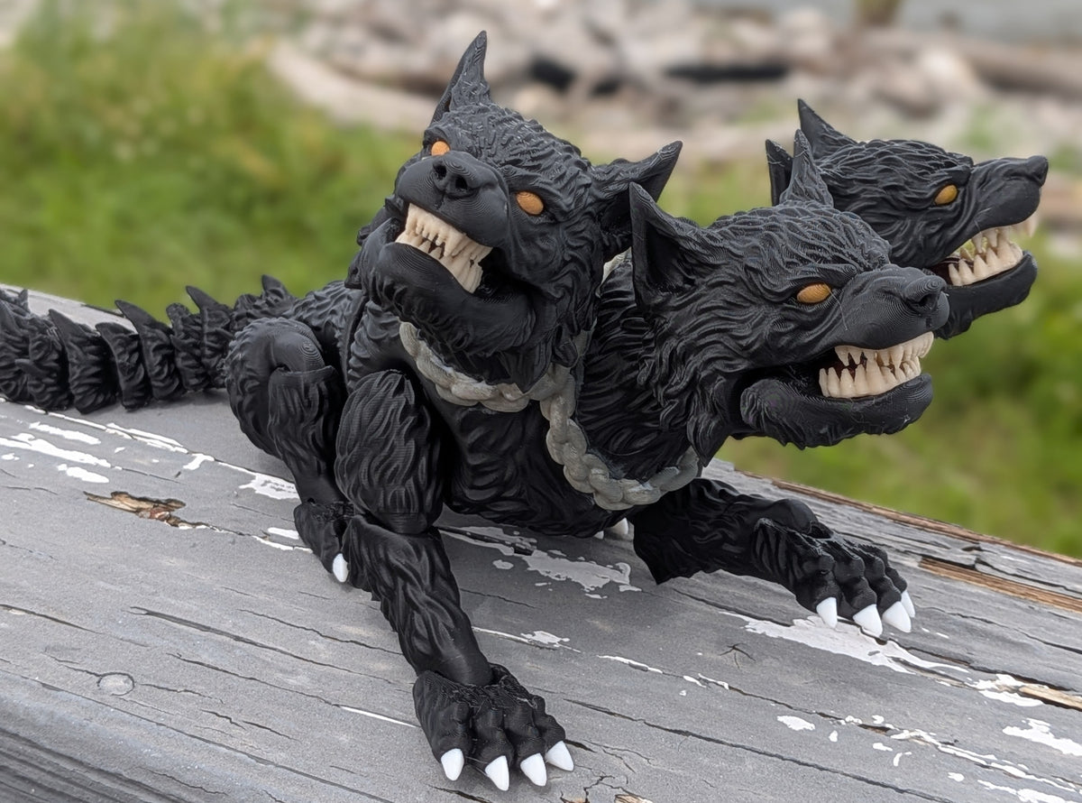 Hand-painted articulated Cerberus figure with three snarling heads and a spiked tail