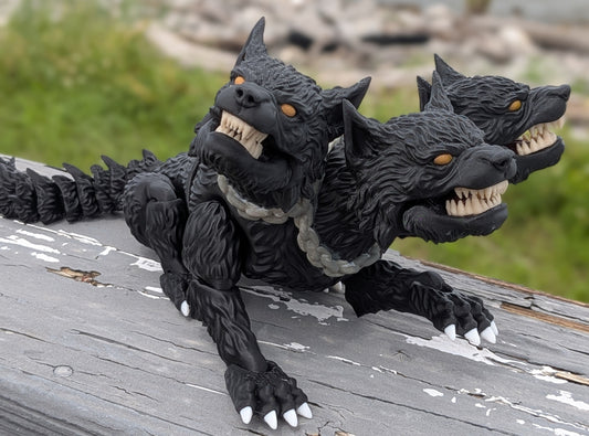 Hand-painted articulated Cerberus figure with three snarling heads and a spiked tail