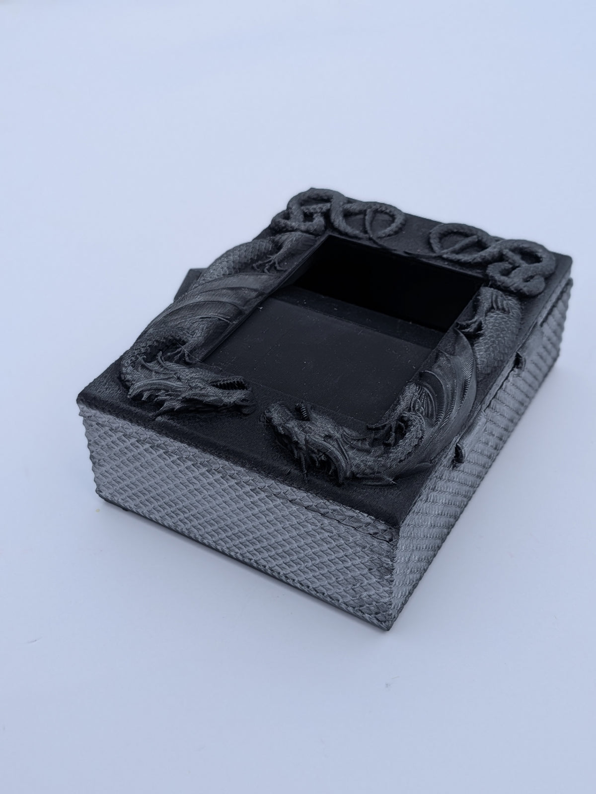Dragon deck box, side view of the carved serpent knotwork