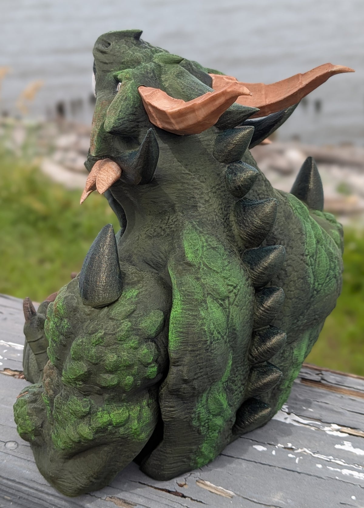 Side angle of the devourer dice tower with head turned and mouth open