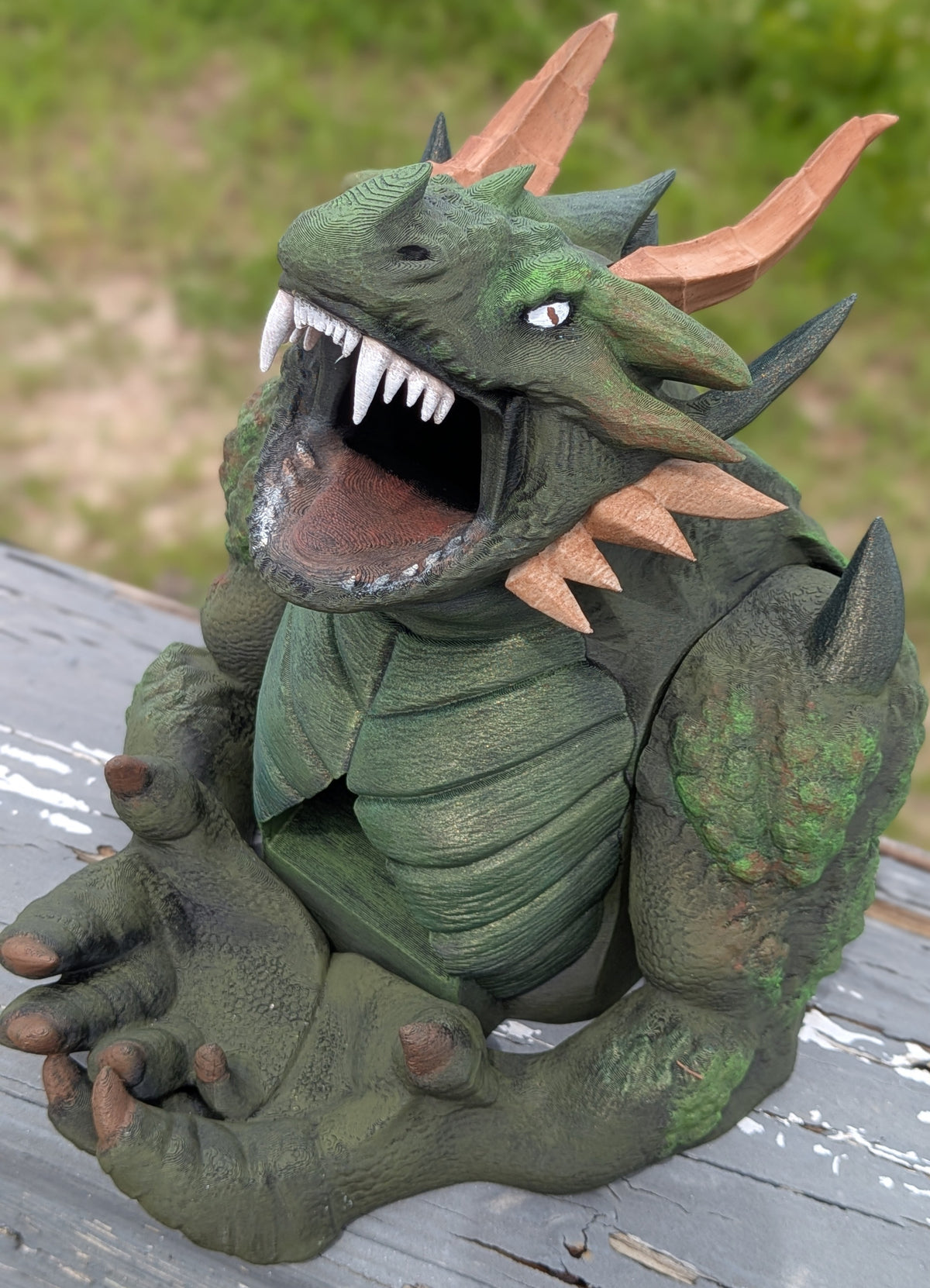 Close-up front view of the devourer dice tower's open mouth and painted fangs