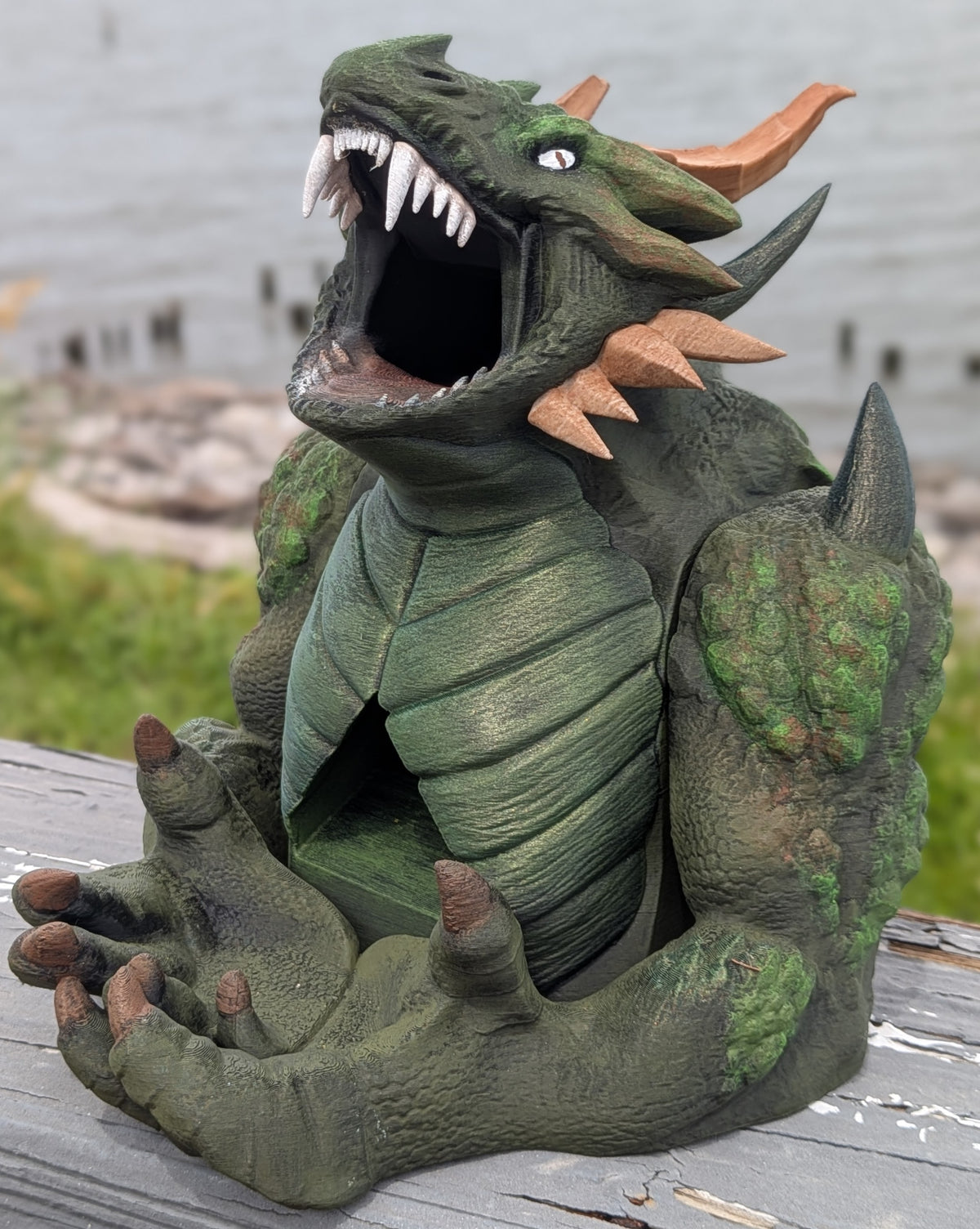 Full front view of the devourer dice tower sitting with claws open to catch dice