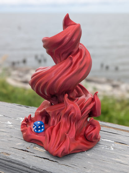 Flame dice tower with a die resting in the flame base opening