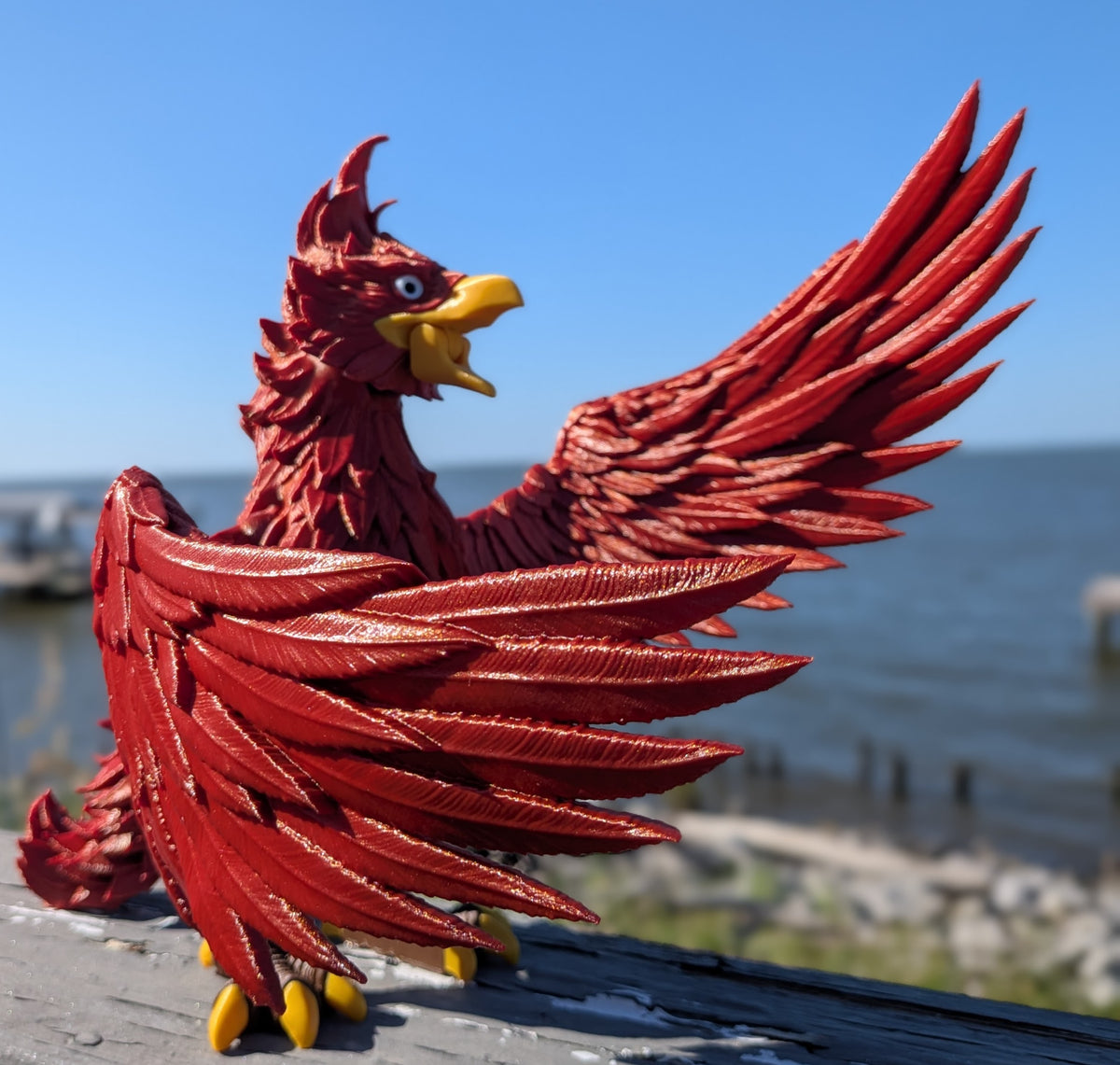 Articulated phoenix figure, close-up of the head and beak