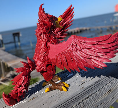 Articulated phoenix figure, side view showing posed legs and tail