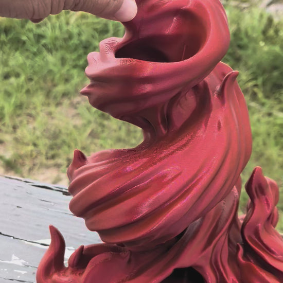 Red flame-shaped 3D printed dice tower with built-in dice tray base