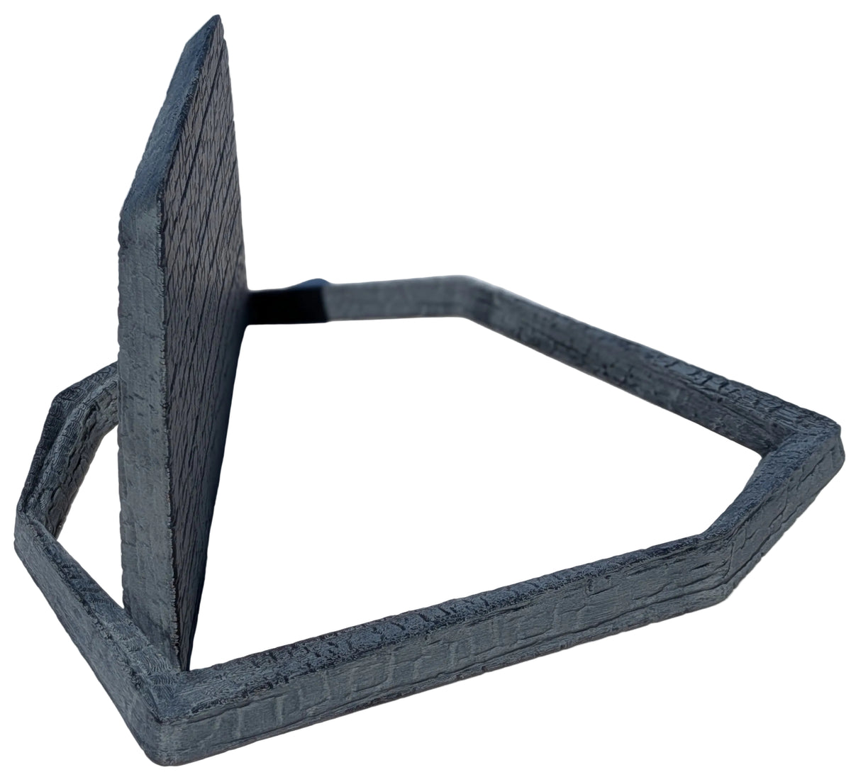 A dark gray 3D-printed geometric hexagonal frame with a vertical panel, photographed on a light marble tile floor.