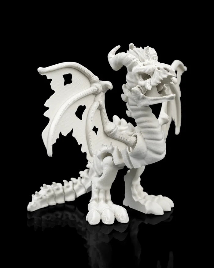 Articulated white dragon skeleton figure, posed standing, side view
