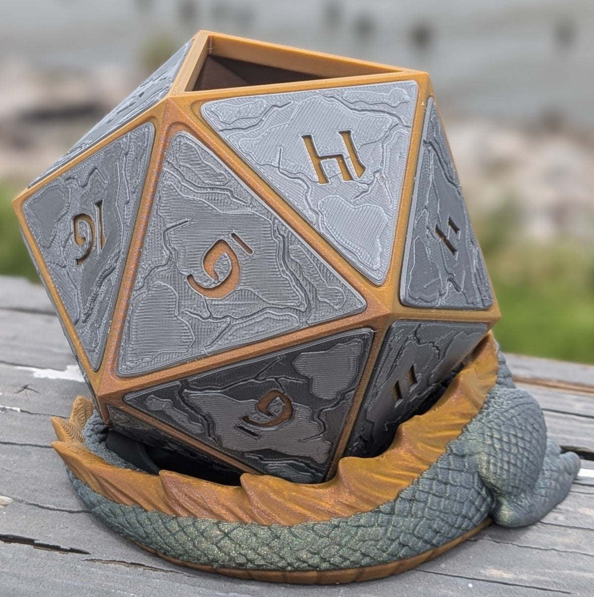 Sleeping dragon D20 planter, close-up of the die faces