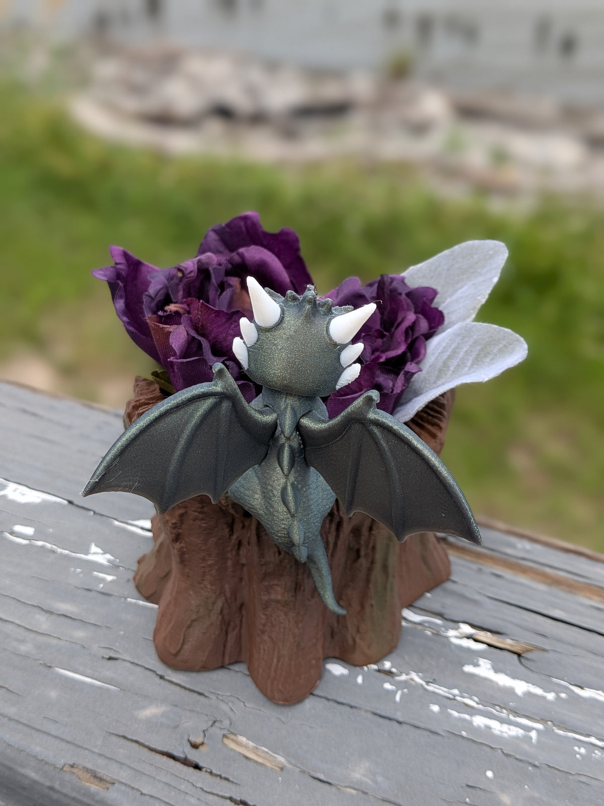 Dragon stump planter, close-up of the dragon's wings and horns