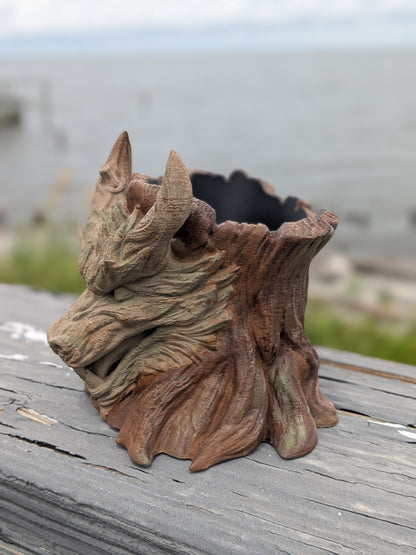 Dragon face stump planter, close-up of the carved horns and eyes