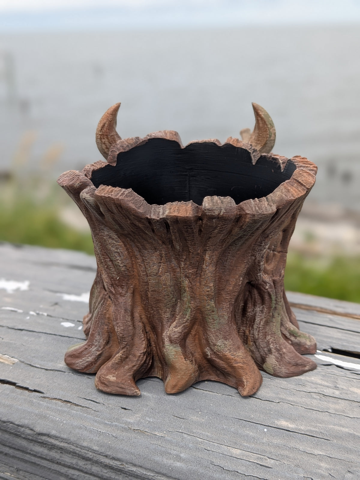 Dragon face stump planter, side angle view